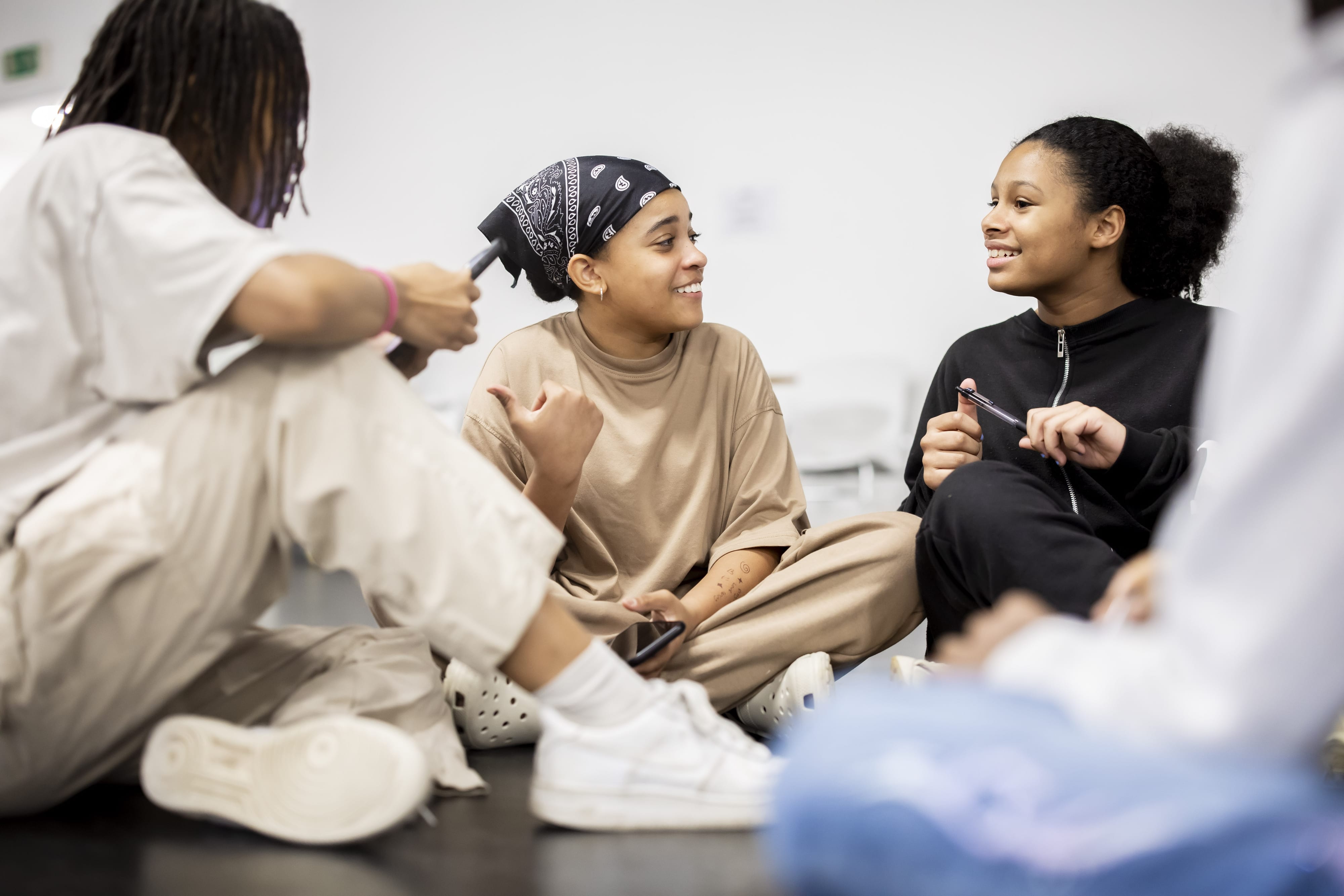 Three people attending Activating Creative Talent CIC's Youth Talent project
