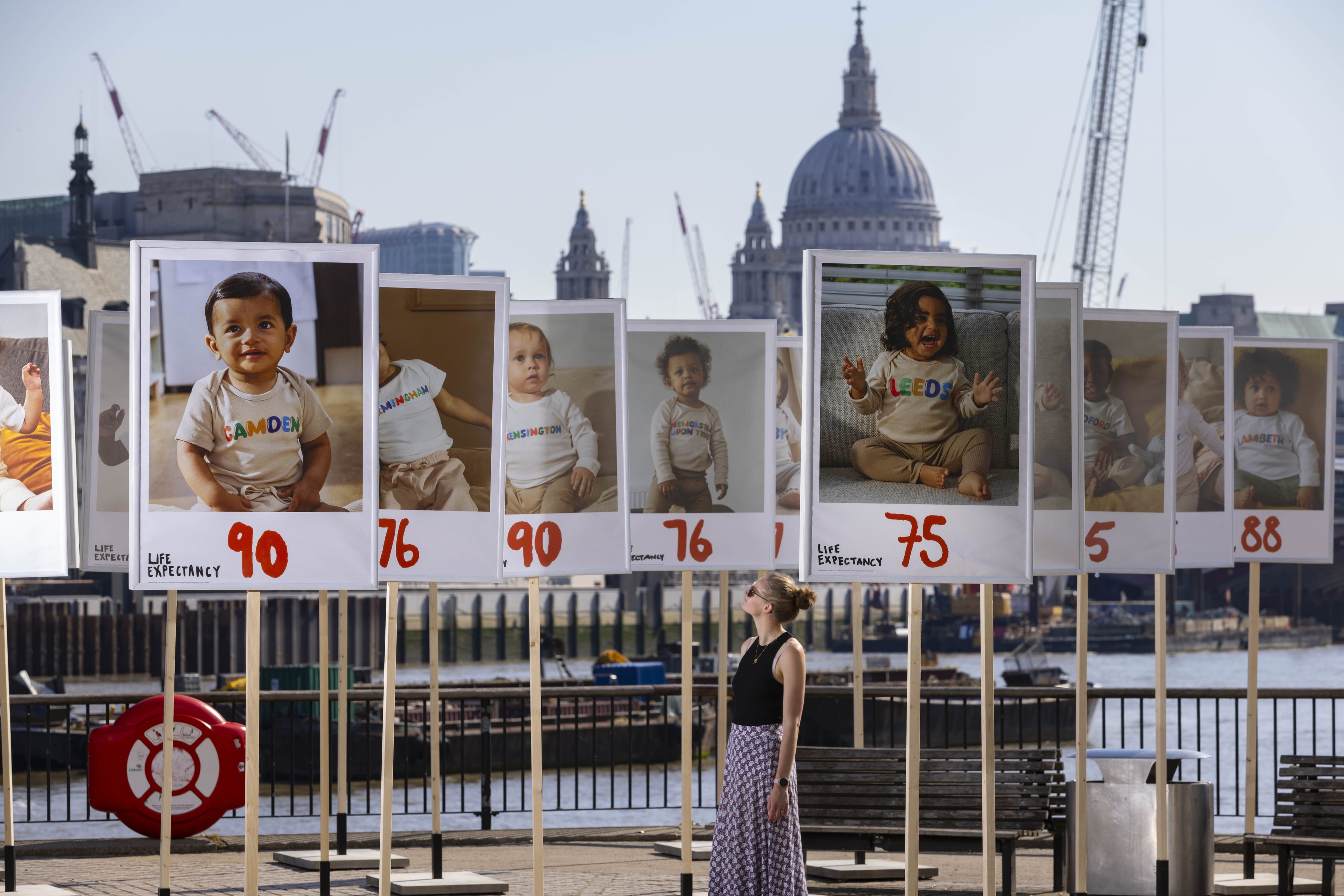 Poster display of babies with life expectancy in their town for Let's Make Health Equal campaign