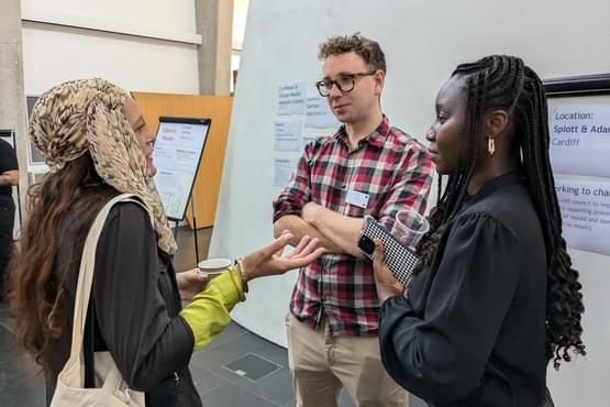 Three people talking