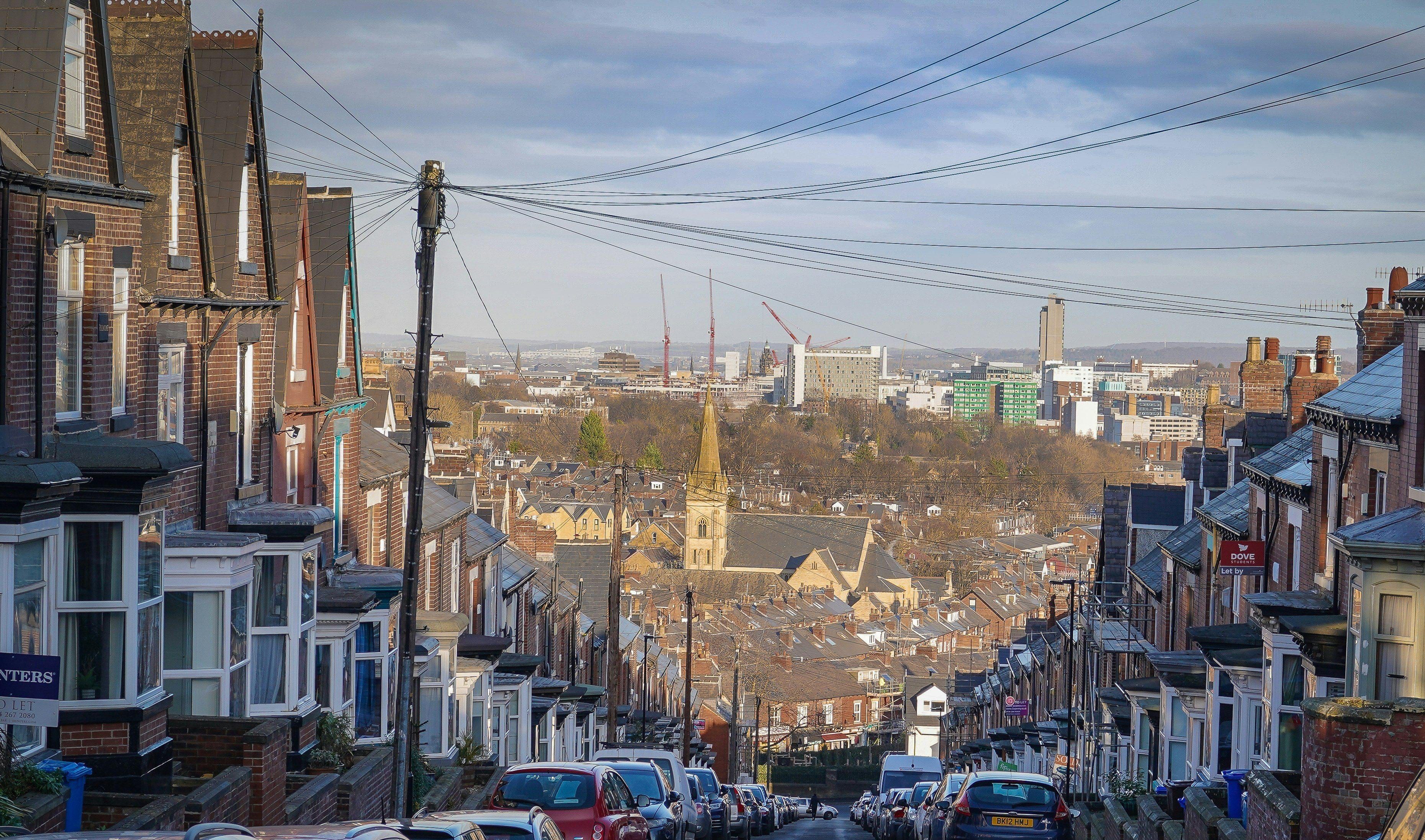 Street on a hill with city in background