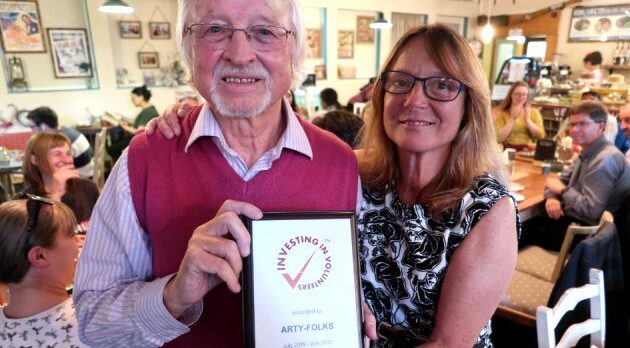 Lorella from Arty-Folks is presented with the Investors in Volunteering accreditation