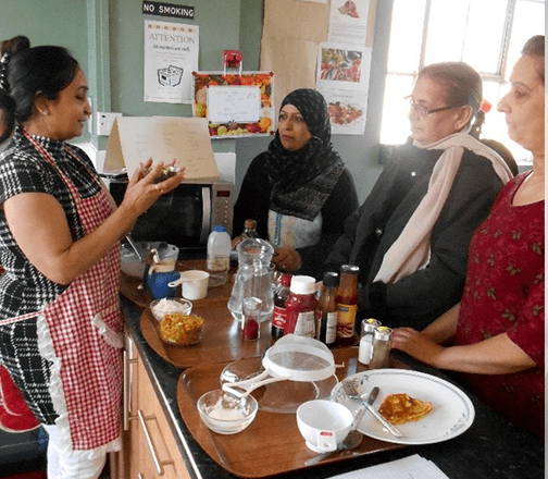 Members of Shama Womens Centre's 'Carers Matter' project enjoy a cookery class together