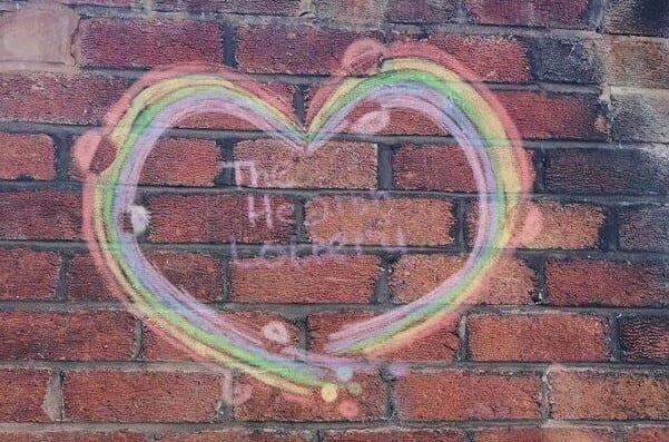 The Health Lottery logo drawn with chalk