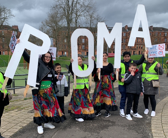 picture for projectStory: A group of people holding up the letters ROMA picture for projectStory: A group of people holding up the letters ROMA
