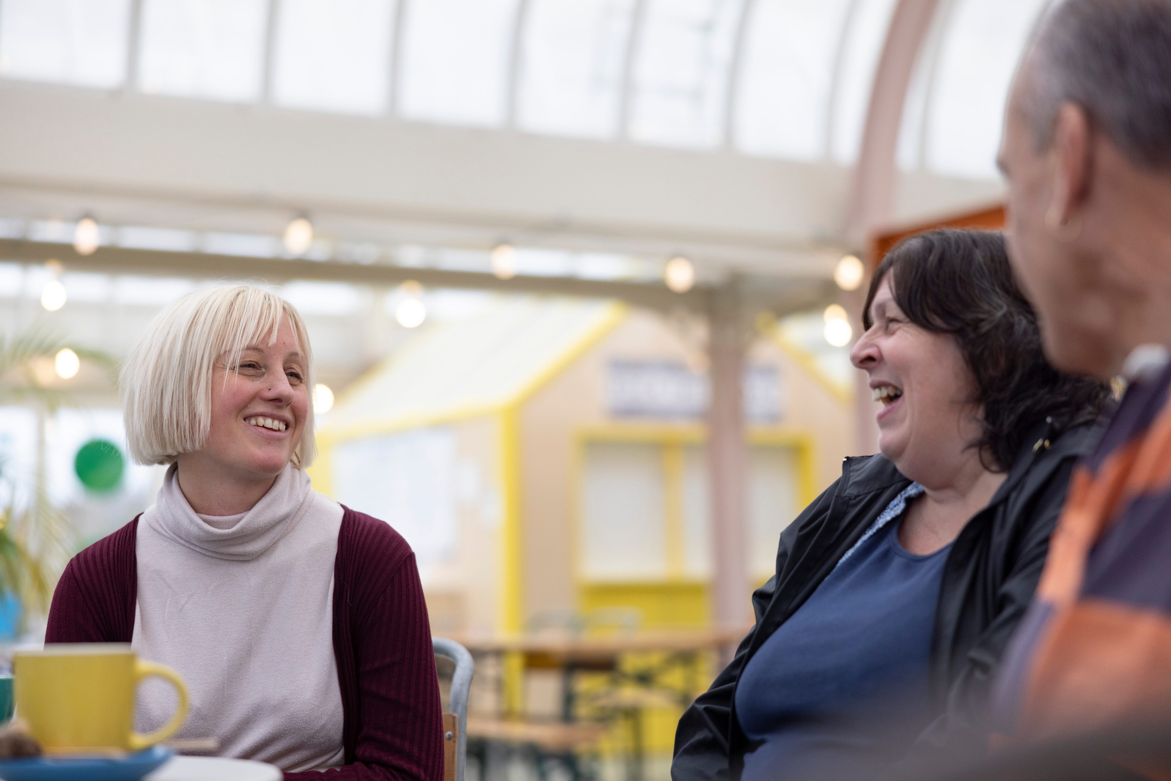 Three people from the Local Conversation in Kirkley in a cafe.
