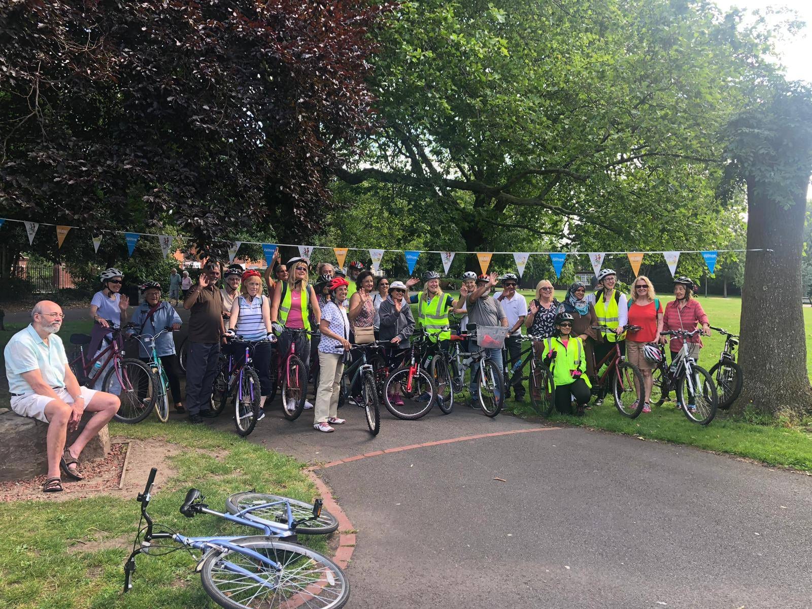 A group of participants posing with bikes