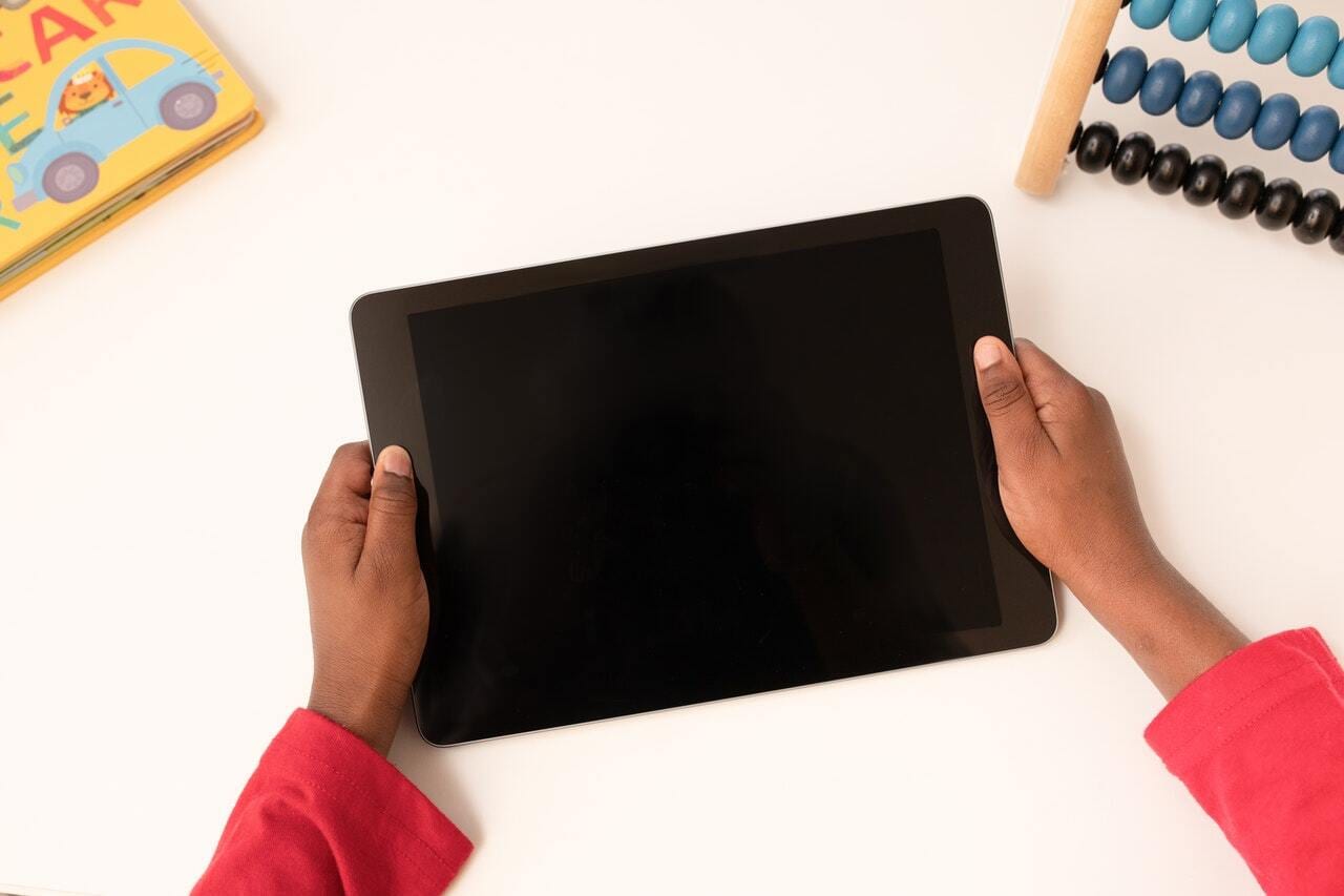 Child holding a tablet