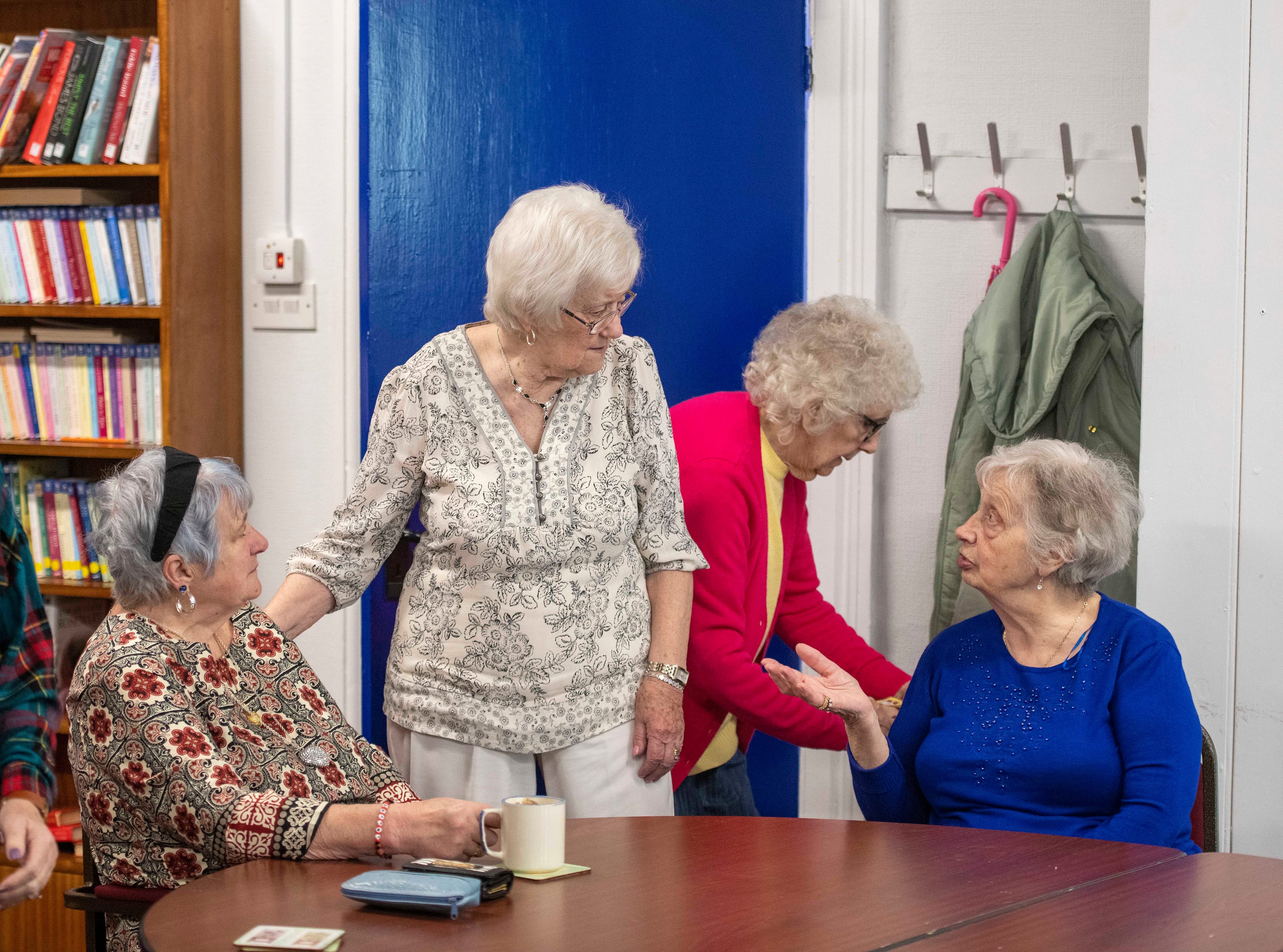 Four older people having a chat